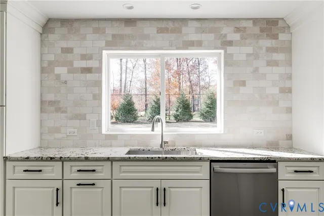 a view of a kitchen with white cabinets