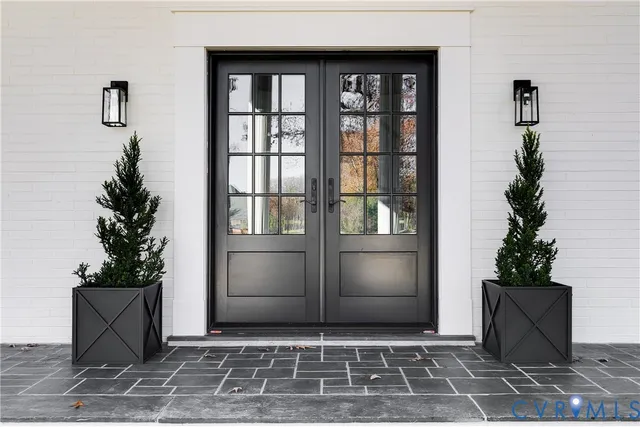 a view of a door and a potted plant