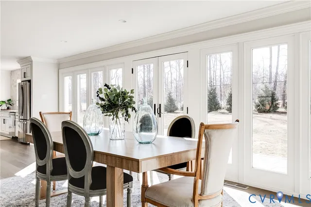 a view of a dining room with furniture and window