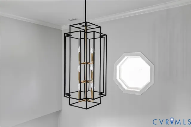 a view of hallway with stairs to wooden floor and a chandelier