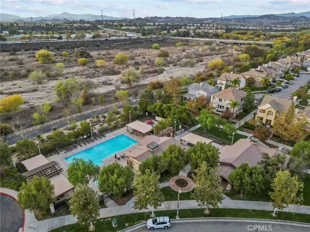 an aerial view of residential houses with outdoor space