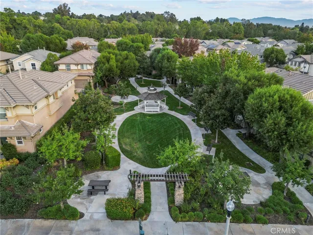 an aerial view of a house with outdoor space and street view
