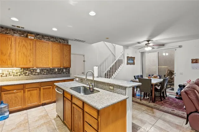 a kitchen with a sink and cabinets