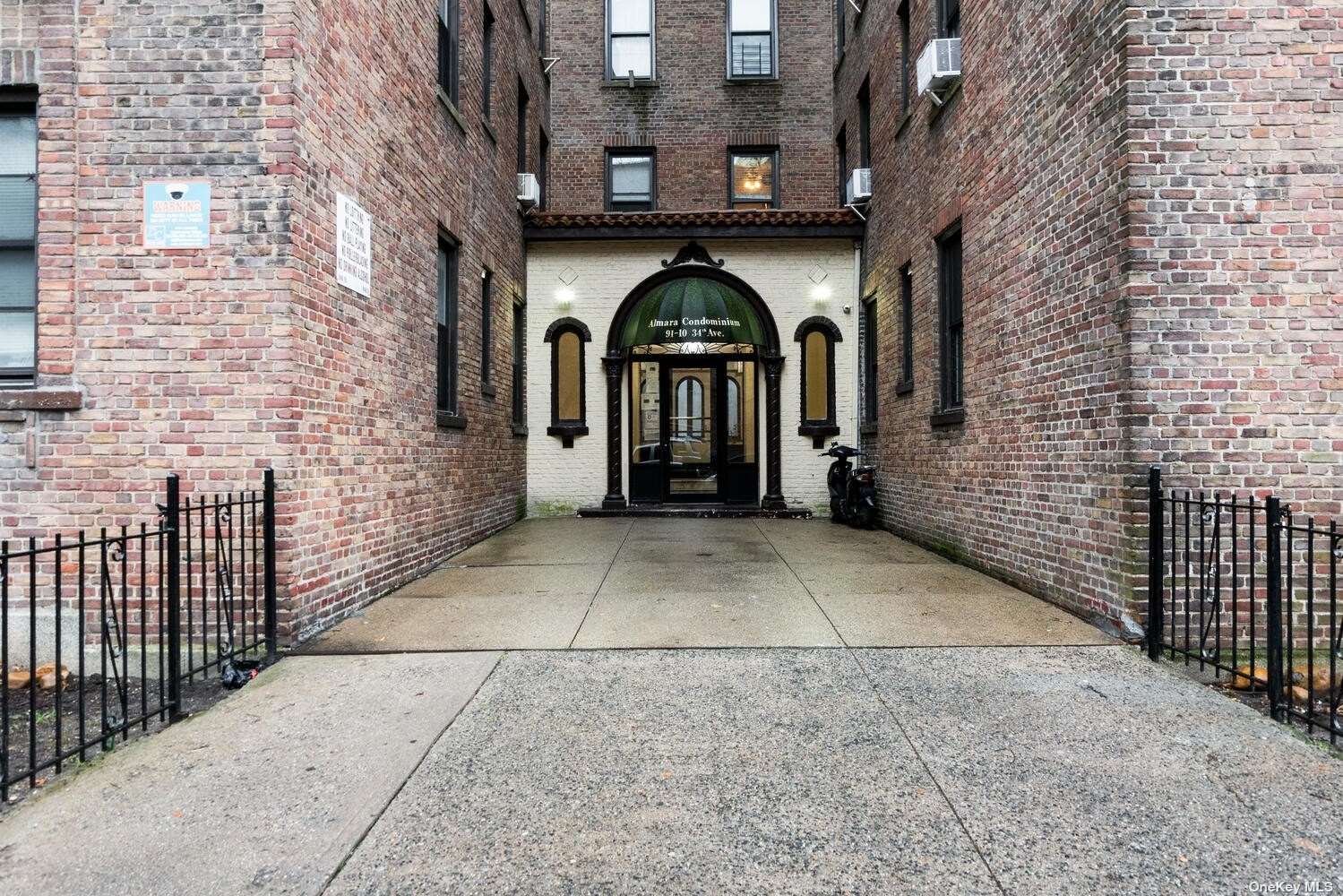 a view of entryway with brick walls