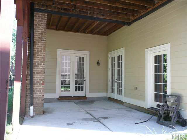 7333 Newport Avenue Raleigh, NC 27613 - Photo 19 of 20 patio in the back, double doors from the basement. Basement