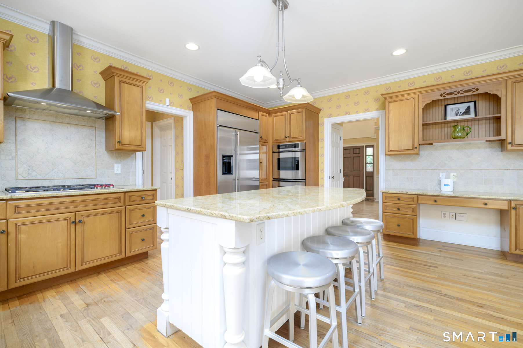 53 Wolfpit Road Wilton, CT 06897 - Photo 11 of 40 a large kitchen with stainless steel appliances granite countertop a stove and a wooden floors