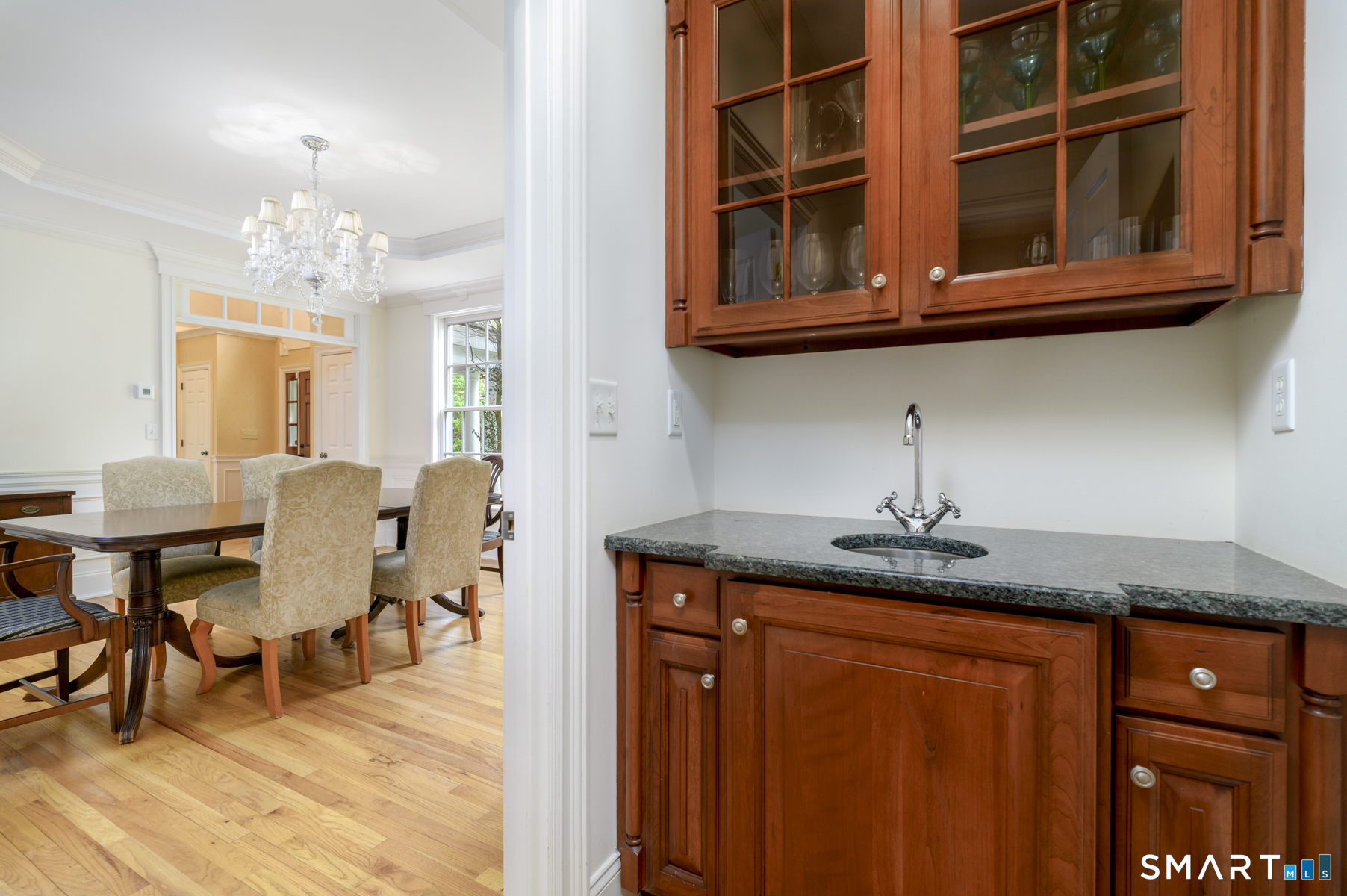 53 Wolfpit Road Wilton, CT 06897 - Photo 16 of 40 a kitchen with stainless steel appliances granite countertop a sink dishwasher and cabinets with wooden floor