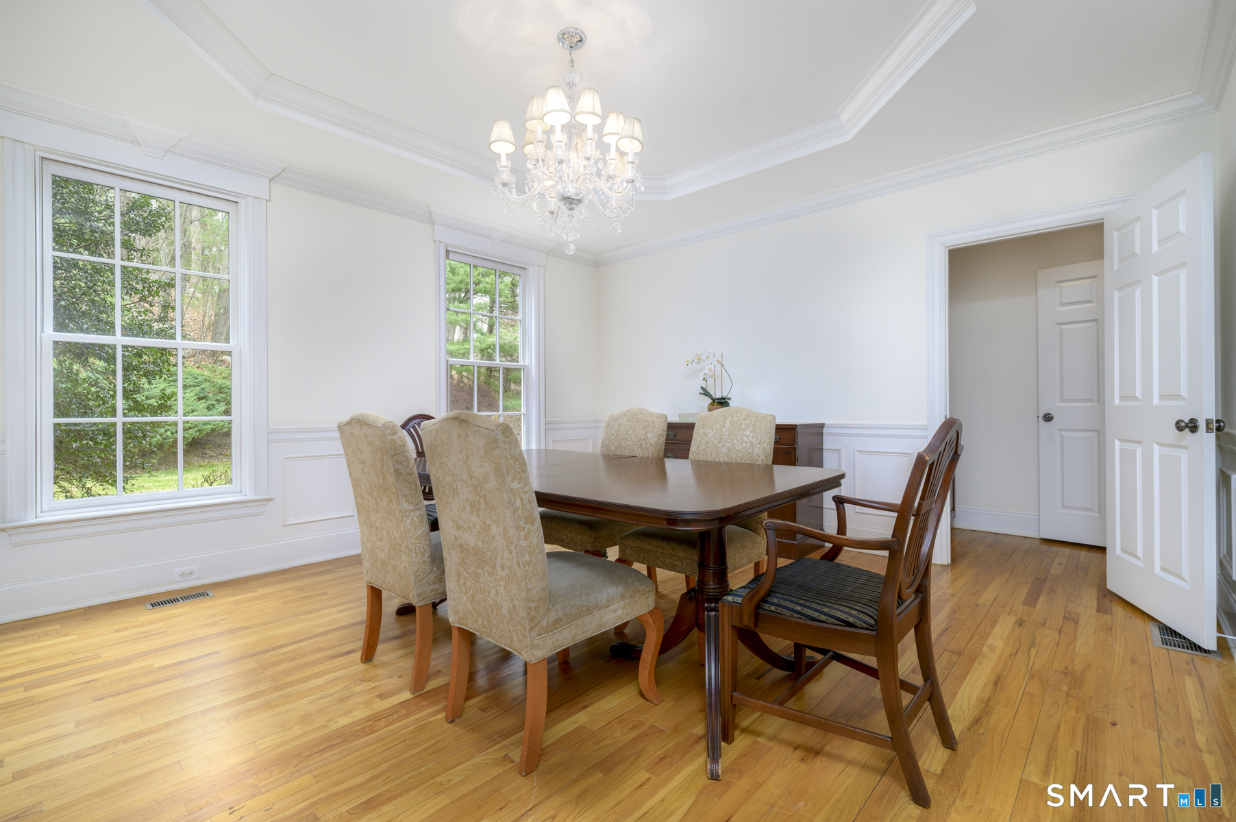 53 Wolfpit Road Wilton, CT 06897 - Photo 18 of 40 a view of a dining room with furniture window and wooden floor