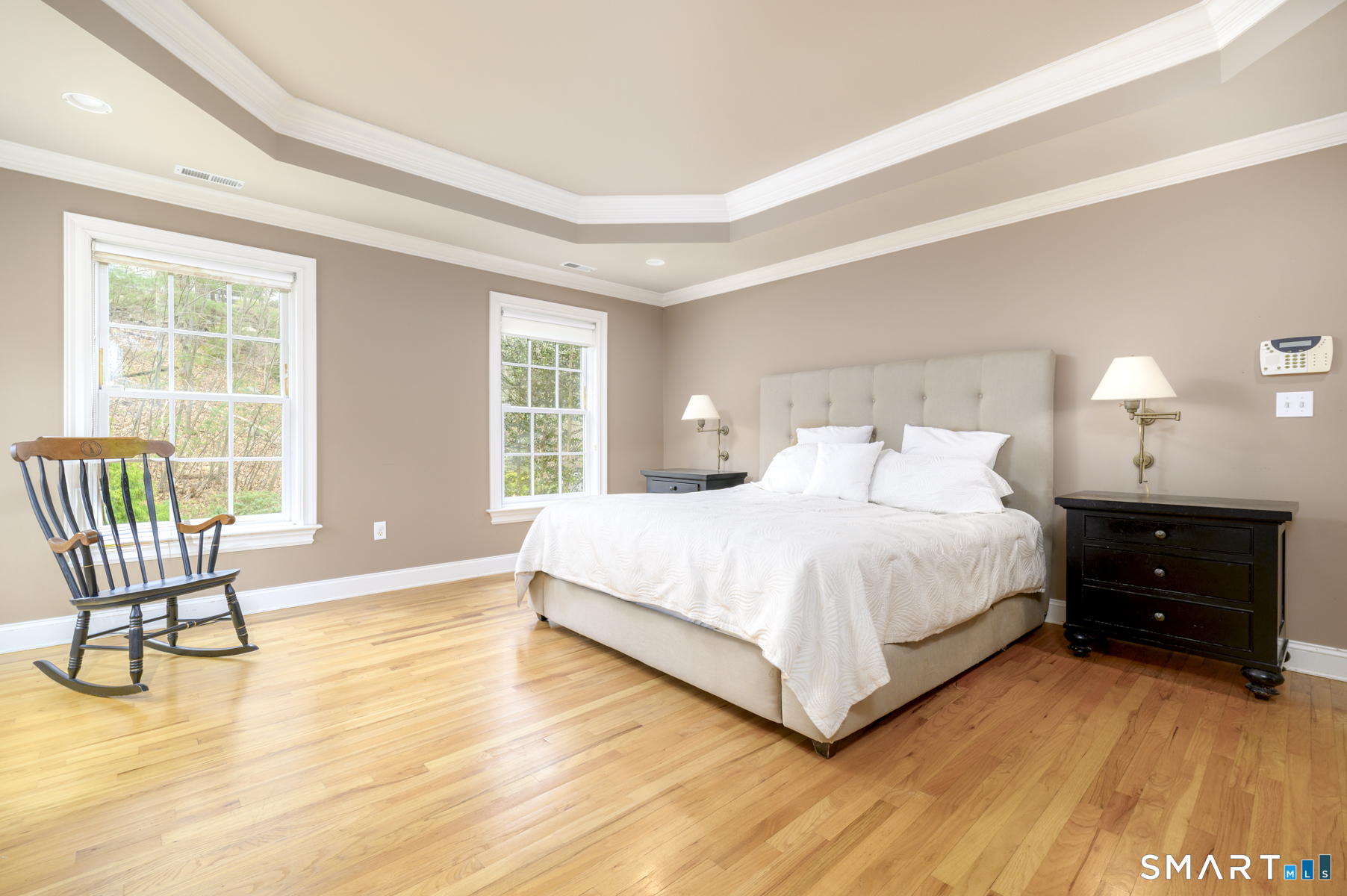 53 Wolfpit Road Wilton, CT 06897 - Photo 23 of 40 a bedroom with a bed and a couch