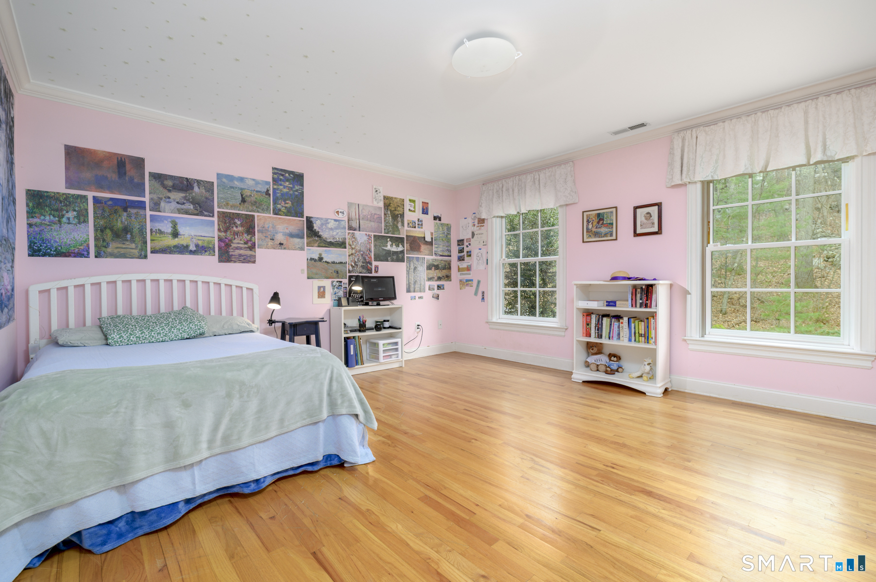 53 Wolfpit Road Wilton, CT 06897 - Photo 26 of 40 a spacious bedroom with a bed and a large window