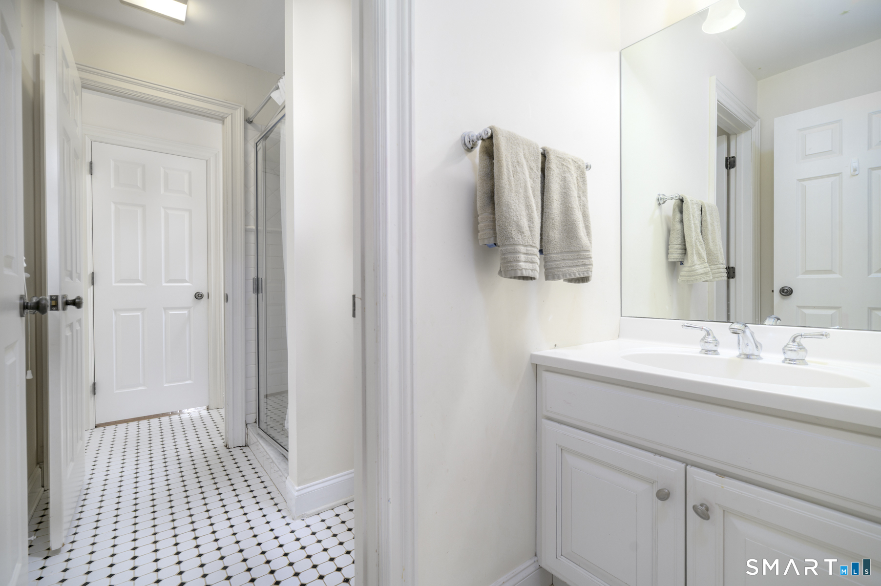53 Wolfpit Road Wilton, CT 06897 - Photo 28 of 40 a bathroom with a sink and a mirror