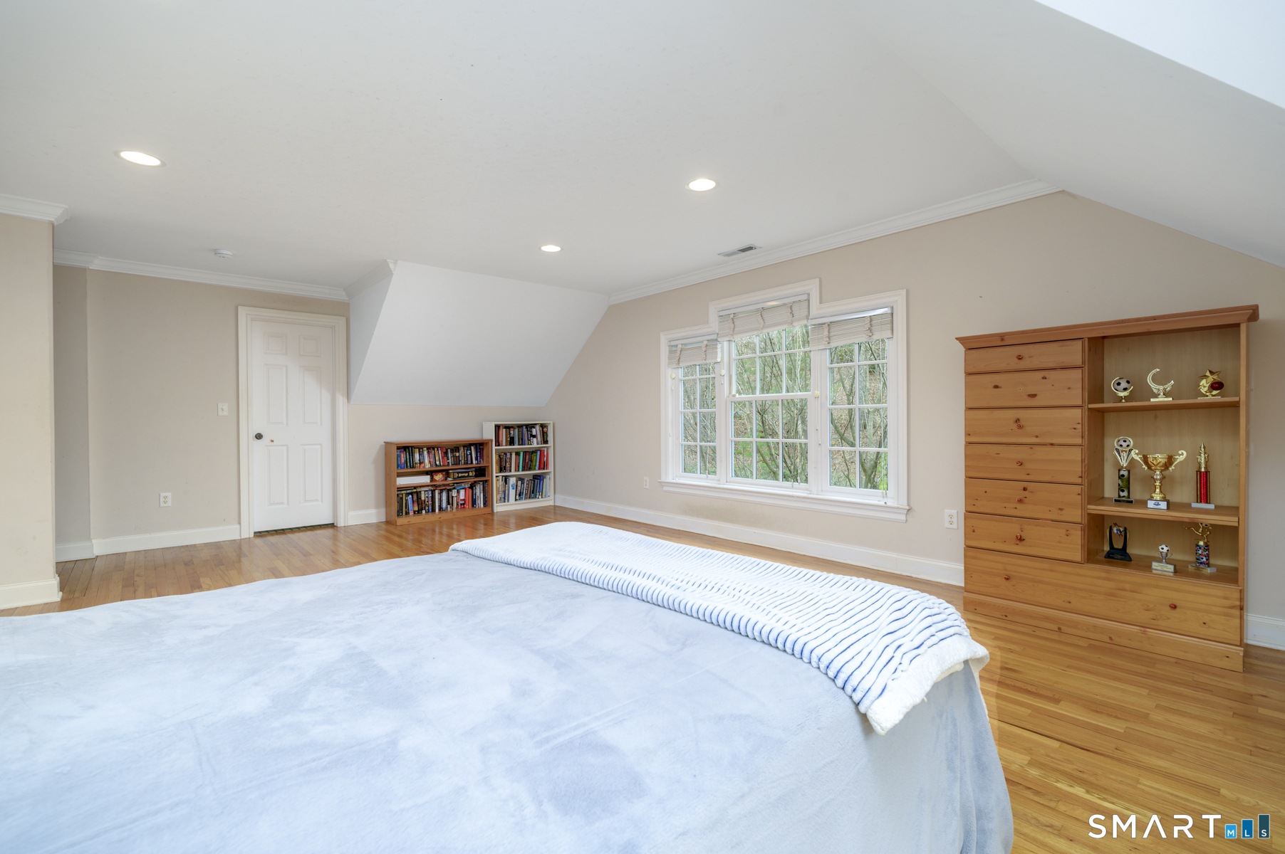 53 Wolfpit Road Wilton, CT 06897 - Photo 30 of 40 a bed room with a bed and a large window