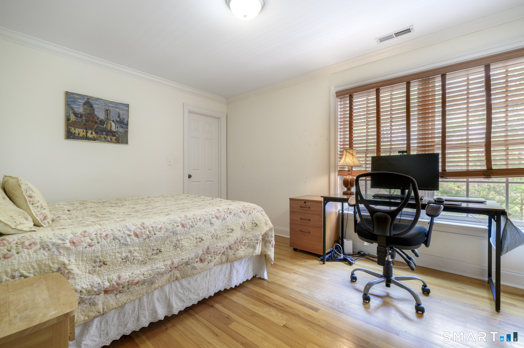53 Wolfpit Road Wilton, CT 06897 - Photo 31 of 40 a bedroom with a bed and a window