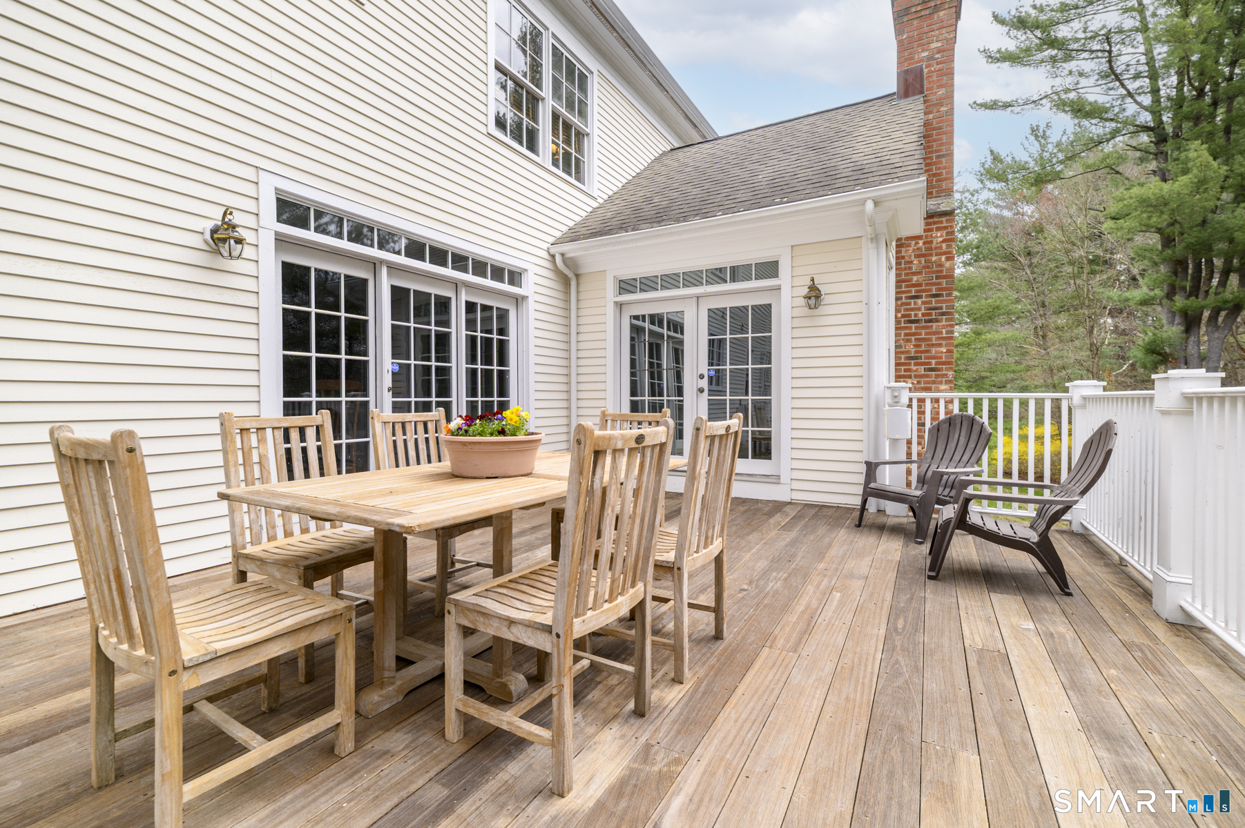 53 Wolfpit Road Wilton, CT 06897 - Photo 37 of 40 a view of a patio with a table and chairs