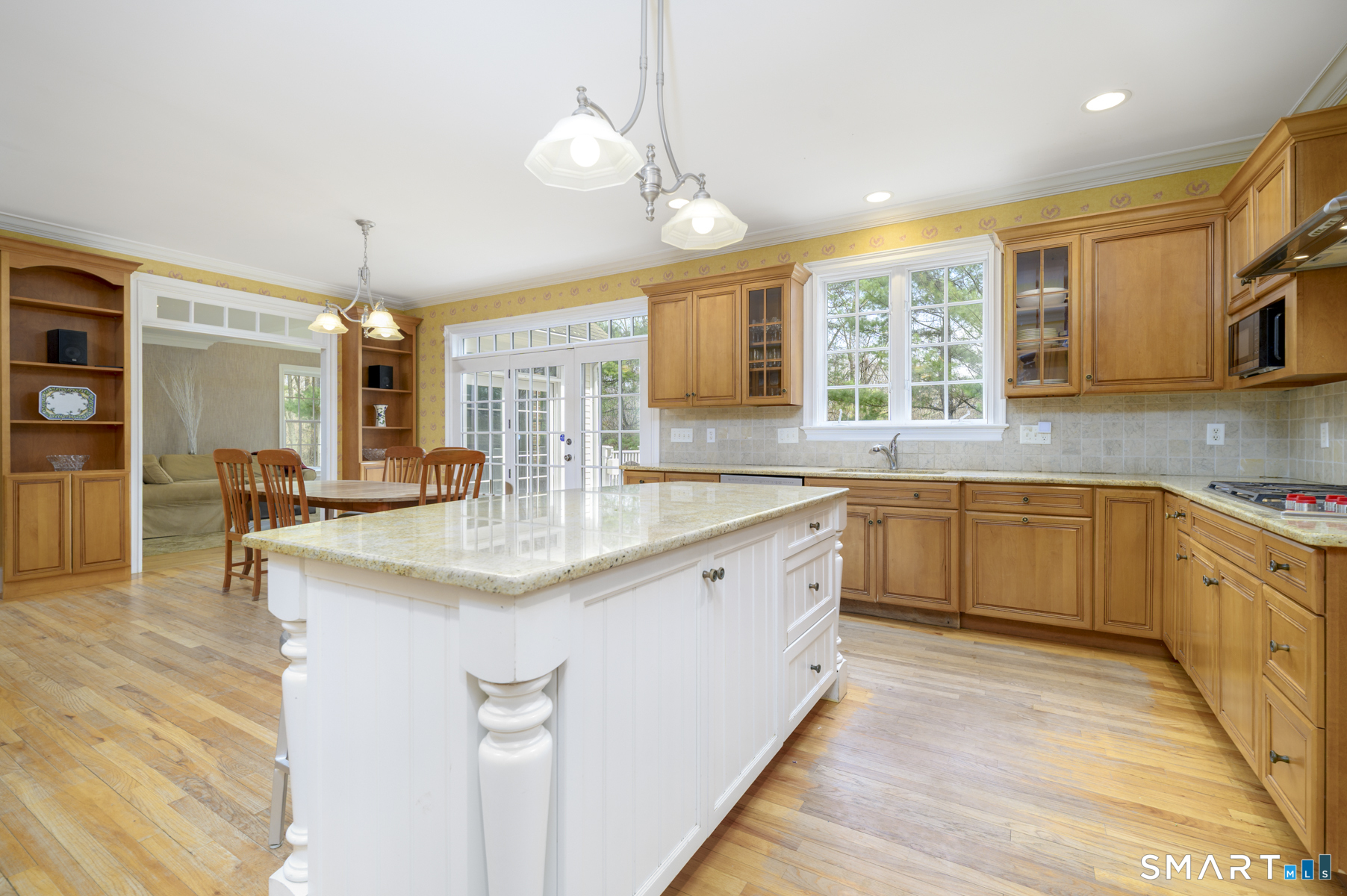 53 Wolfpit Road Wilton, CT 06897 - Photo 10 of 40 a kitchen with granite countertop a sink stove and cabinets