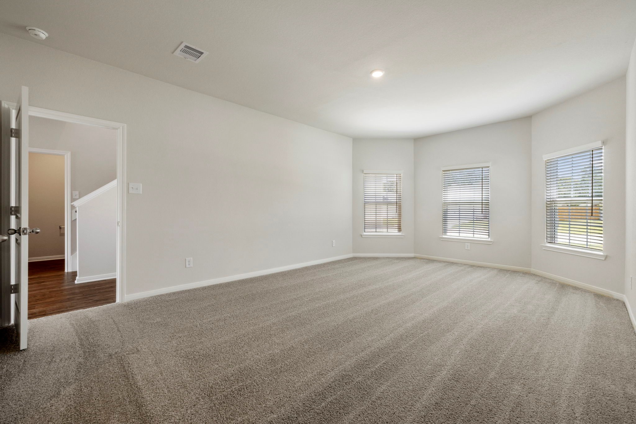 10339 Red Cardinal Drive Cleveland, TX 77328 - Photo 15 of 27 a view of an empty room with a window
