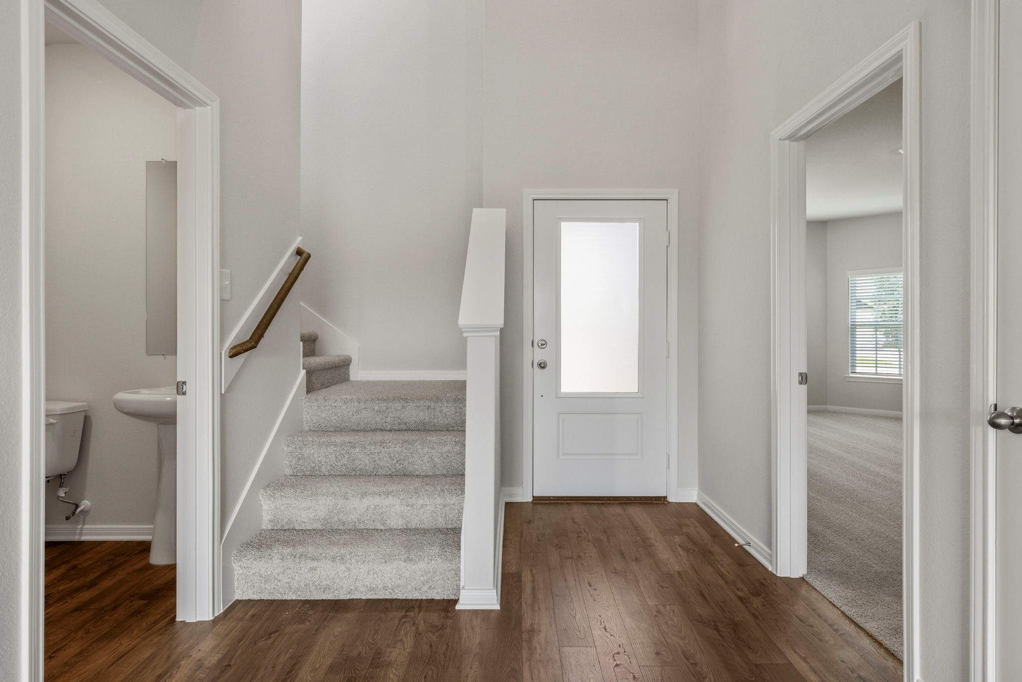 10339 Red Cardinal Drive Cleveland, TX 77328 - Photo 6 of 27 a view of entryway with wooden floor