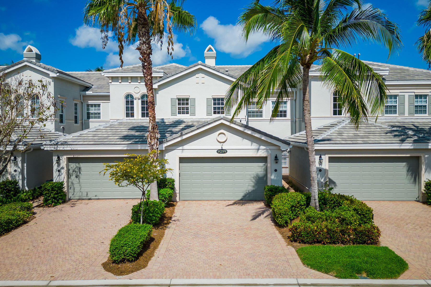 a front view of a house with a garage