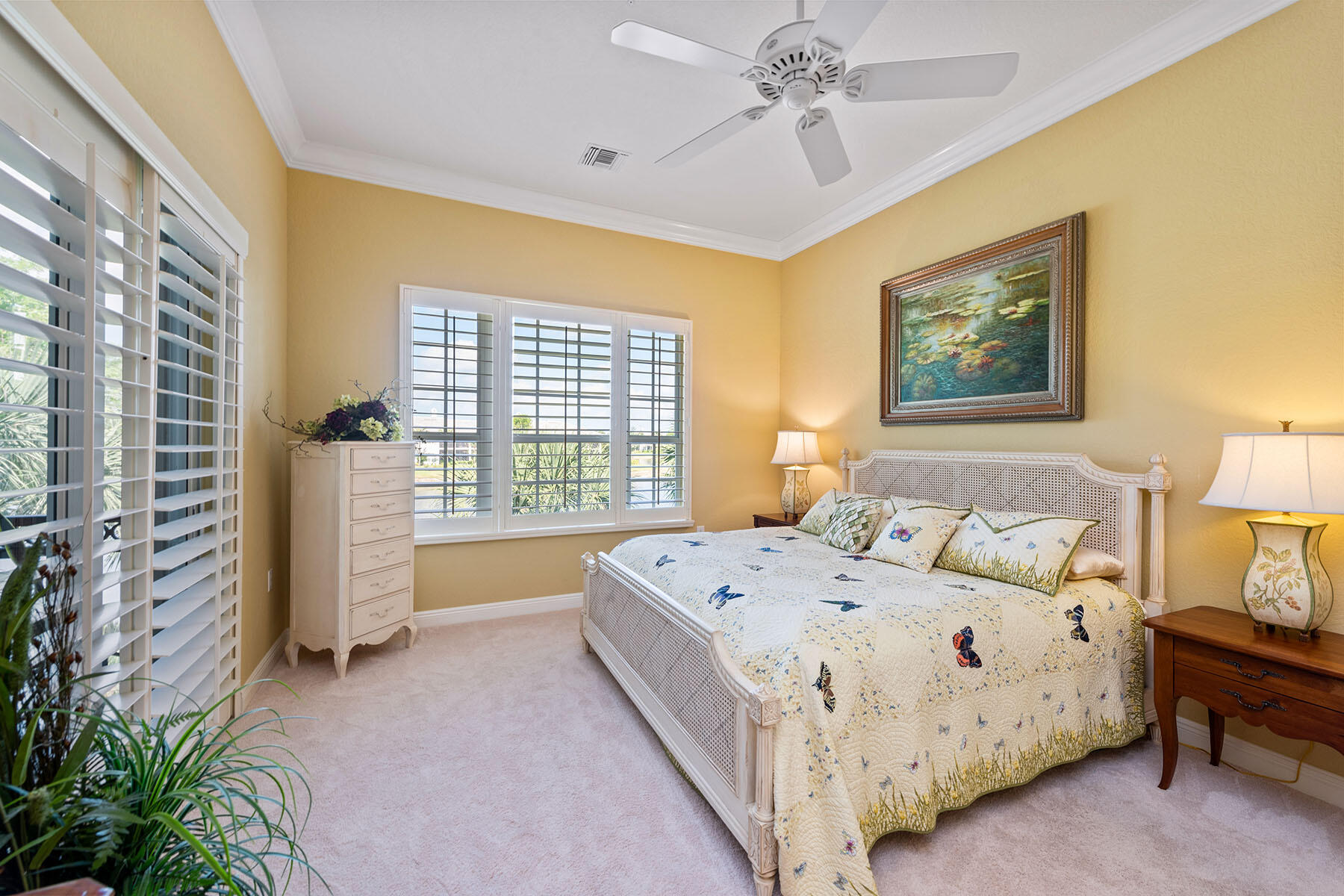 9259 Museo Circle, Unit 203 Naples, FL 34114 - Photo 11 of 46 a bedroom with a bed and a chandelier