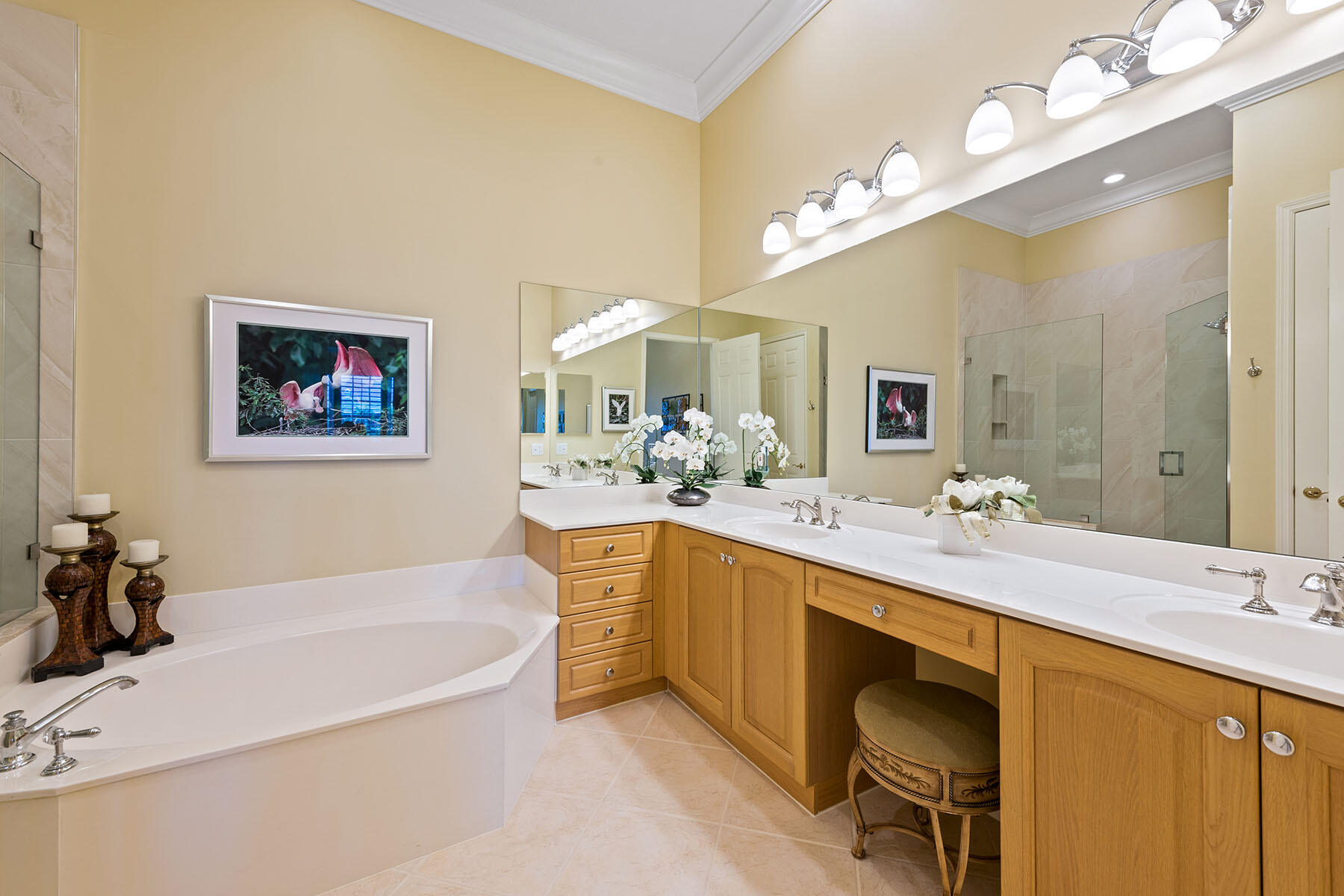 9259 Museo Circle, Unit 203 Naples, FL 34114 - Photo 13 of 46 a spacious bathroom with a sink a large mirror and a bathtub