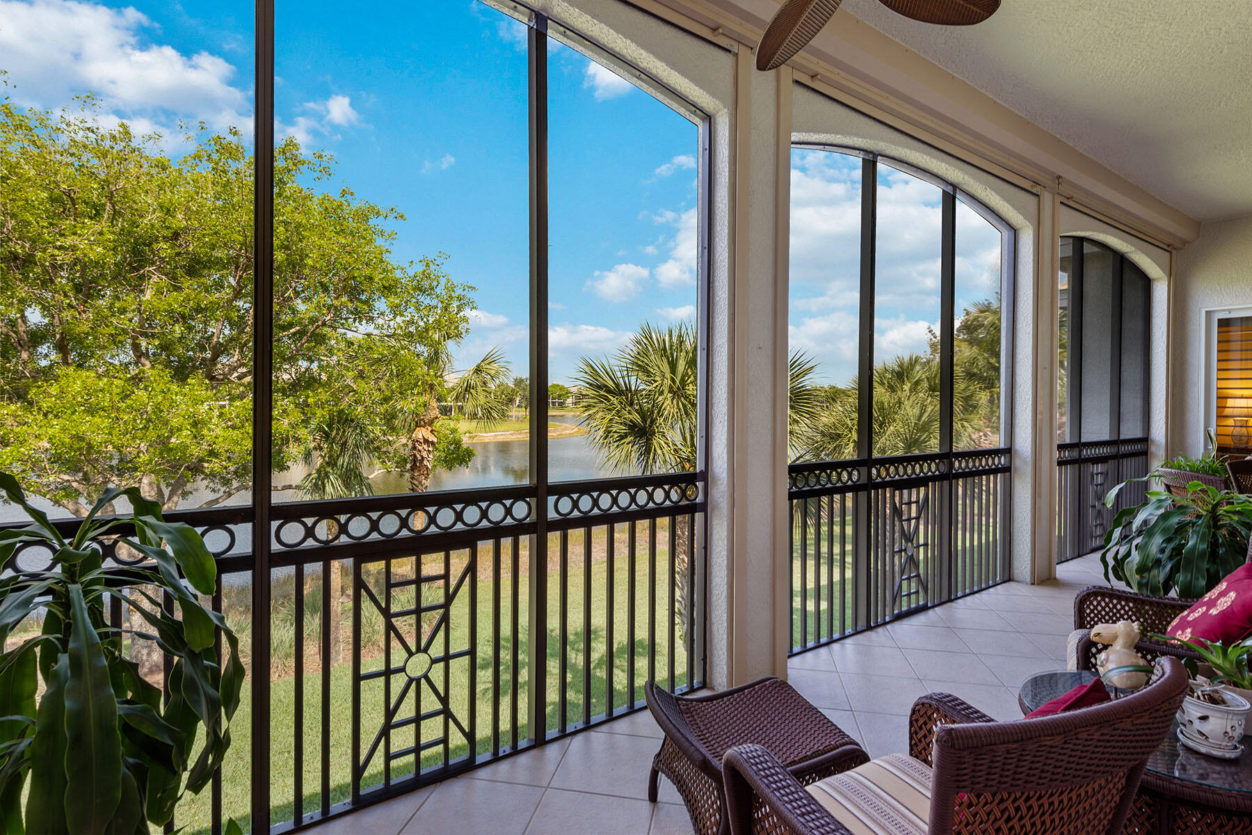 9259 Museo Circle, Unit 203 Naples, FL 34114 - Photo 20 of 46 a view of a balcony with chairs
