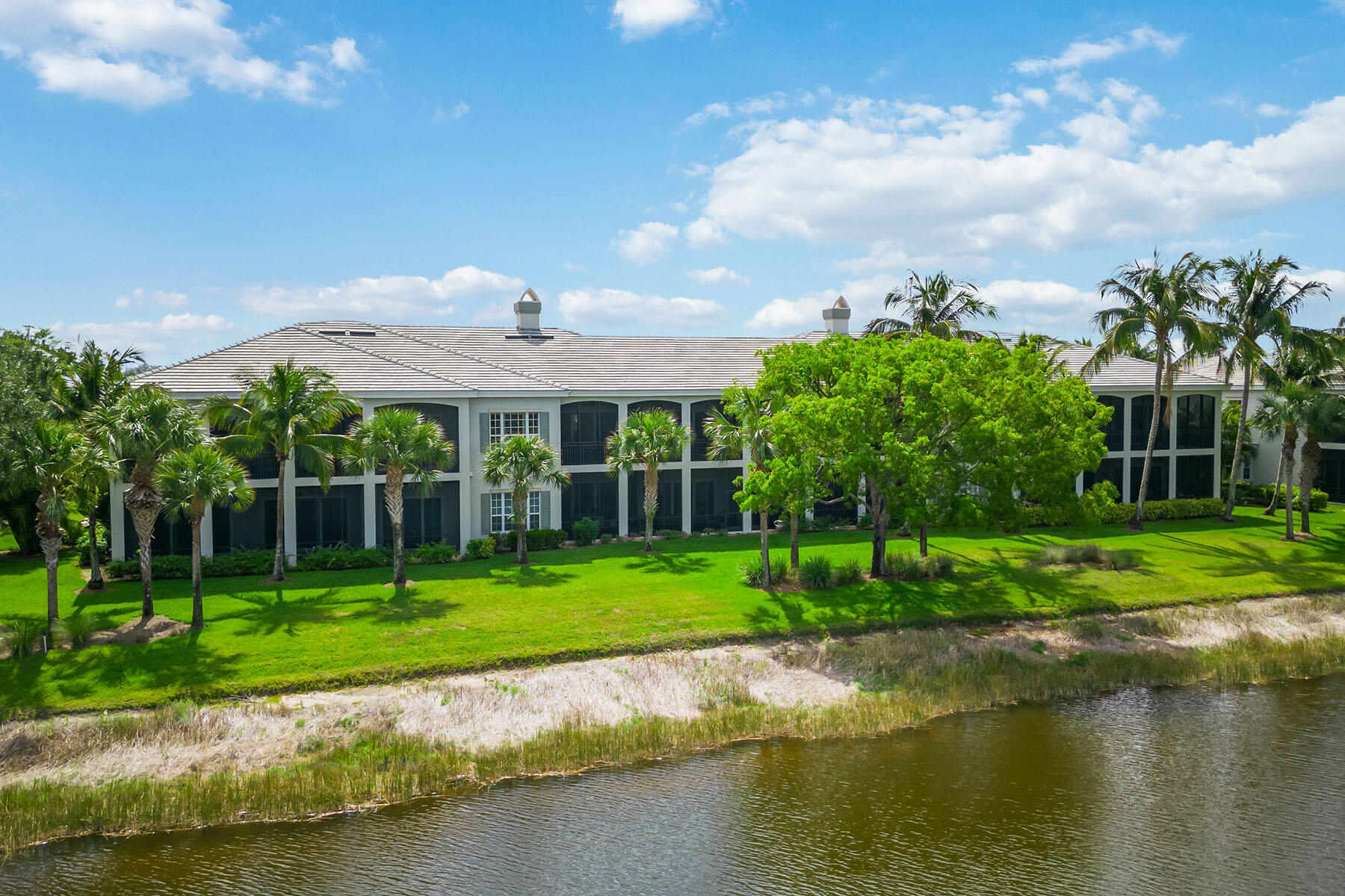9259 Museo Circle, Unit 203 Naples, FL 34114 - Photo 25 of 46 a view of a house with a yard and sitting area