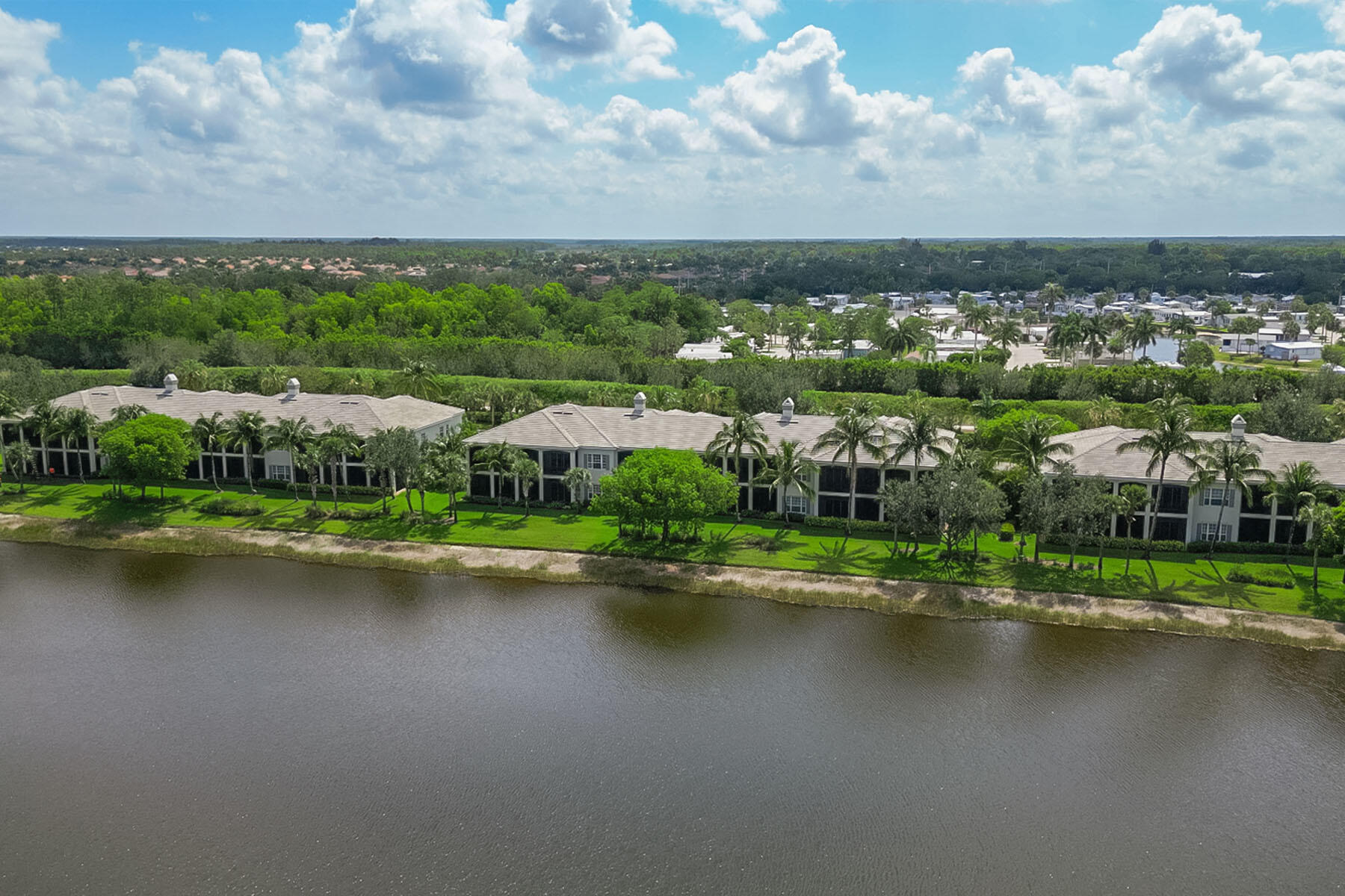 9259 Museo Circle, Unit 203 Naples, FL 34114 - Photo 27 of 46 an aerial view of a city with lots of buildings