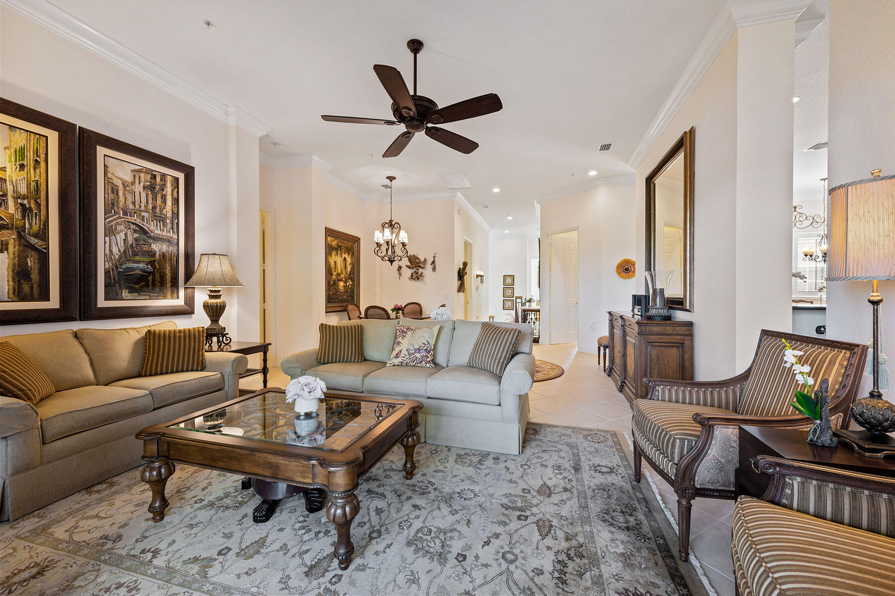 9259 Museo Circle, Unit 203 Naples, FL 34114 - Photo 4 of 46 a living room with furniture a ceiling fan and a window