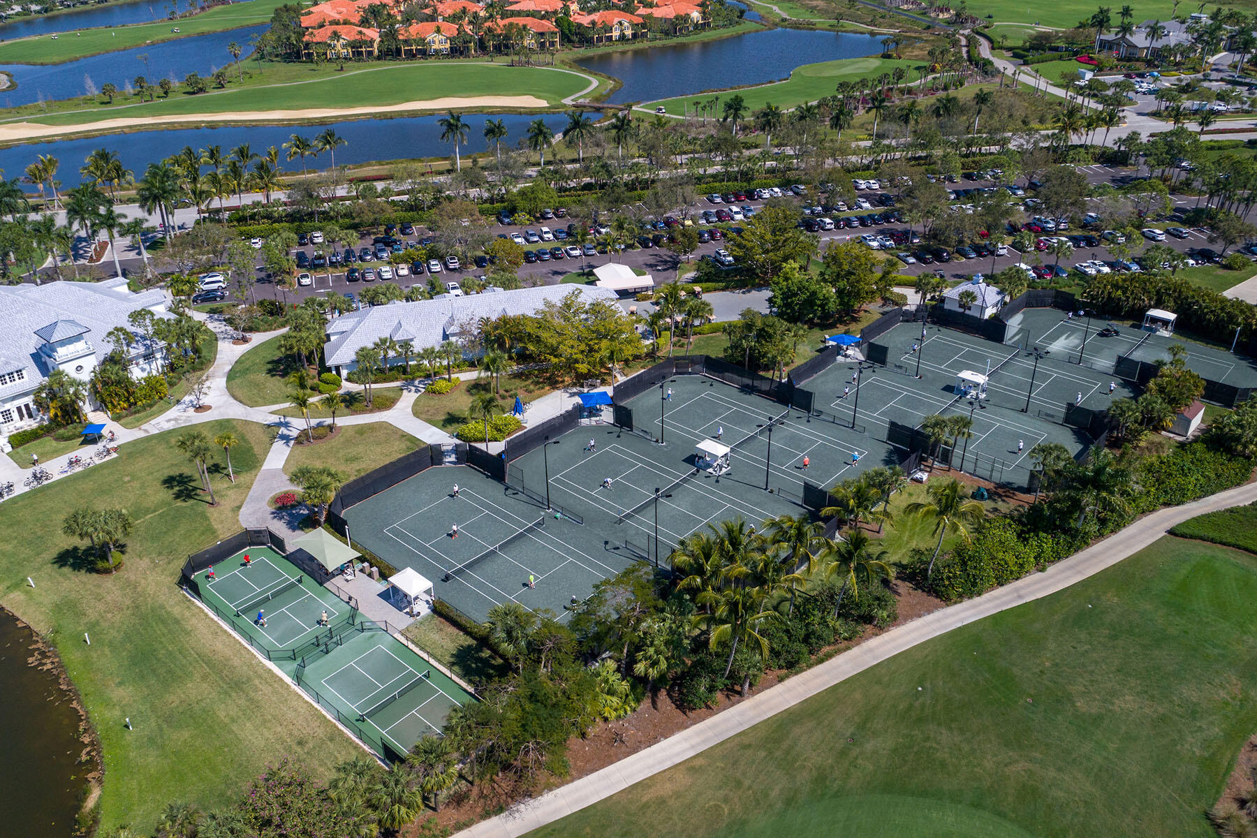 9259 Museo Circle, Unit 203 Naples, FL 34114 - Photo 43 of 46 an aerial view of a city with lots of residential buildings ocean and mountain view in back