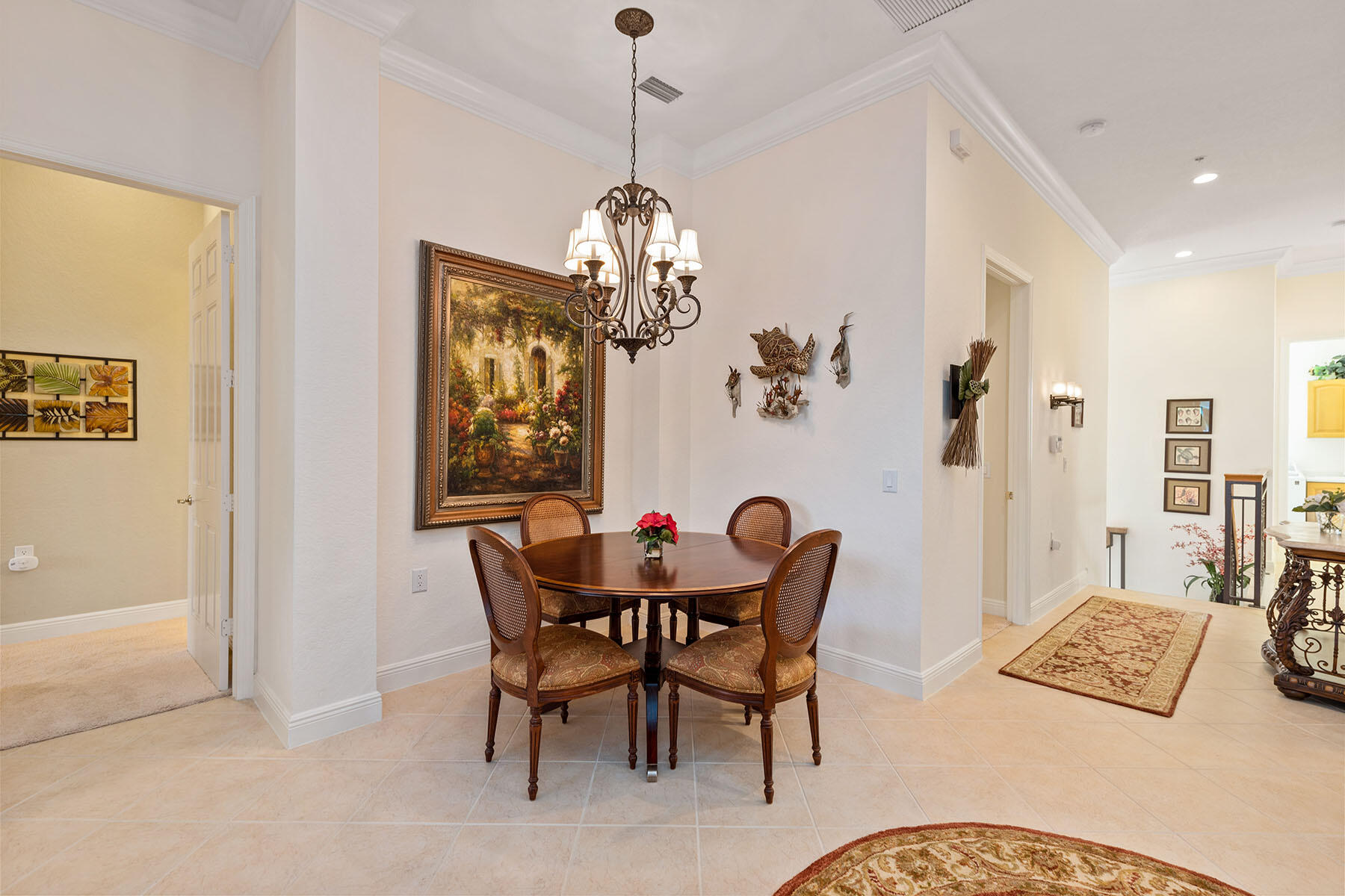 9259 Museo Circle, Unit 203 Naples, FL 34114 - Photo 9 of 46 a view of a dining room with furniture