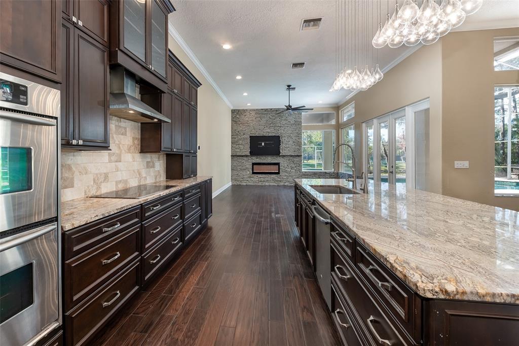 5331 Vista Club Run Sanford, FL 32771 - Photo 13 of 53 a large kitchen with stainless steel appliances