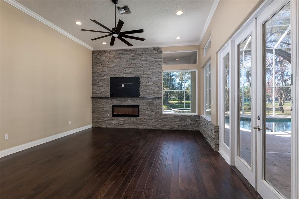 5331 Vista Club Run Sanford, FL 32771 - Photo 18 of 53 a view of a livingroom with a fireplace a ceiling fan and wooden floor