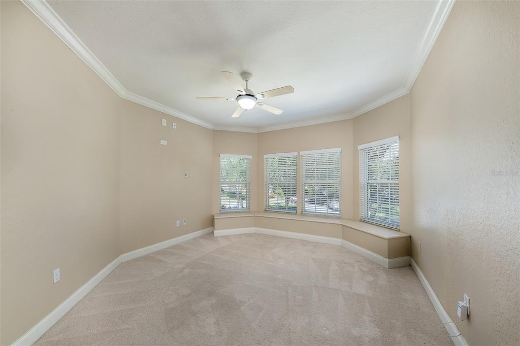 5331 Vista Club Run Sanford, FL 32771 - Photo 28 of 53 an empty room with windows and chandelier fan