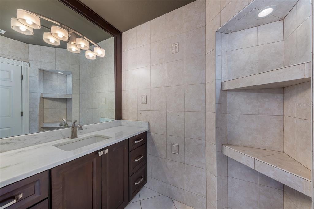 5331 Vista Club Run Sanford, FL 32771 - Photo 34 of 53 a bathroom with a sink vanity and a mirror
