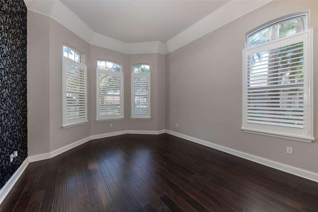 5331 Vista Club Run Sanford, FL 32771 - Photo 10 of 53 a view of an empty room with wooden floor and a window
