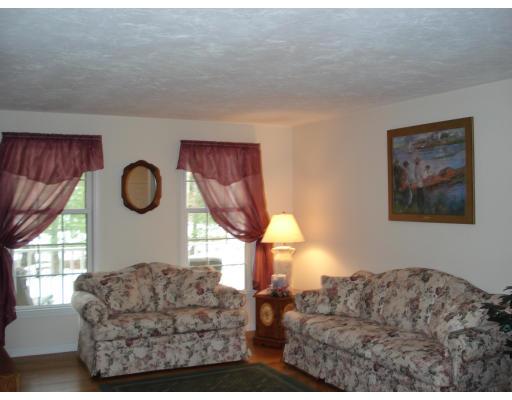 39 Shaker Road Shirley, MA 01464 - Photo 6 of 15 a living room with furniture a window and a chandelier