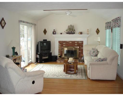 39 Shaker Road Shirley, MA 01464 - Photo 7 of 15 a living room with furniture and a fireplace