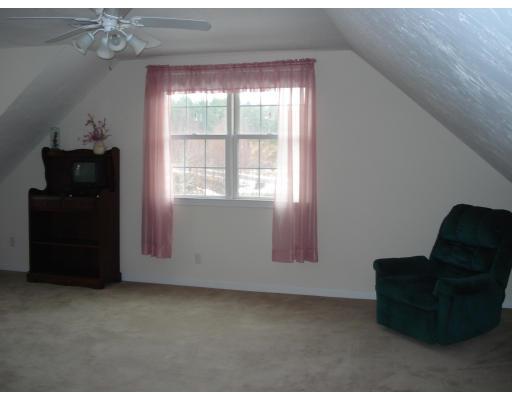 39 Shaker Road Shirley, MA 01464 - Photo 8 of 15 a living room with furniture and a window