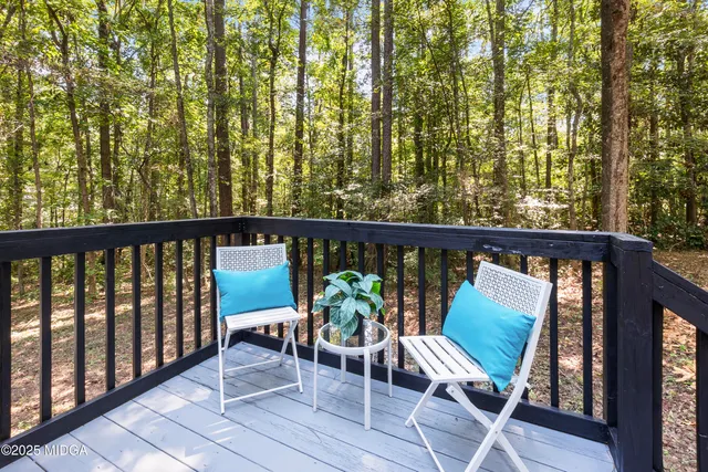 a view of a two chair in the balcony