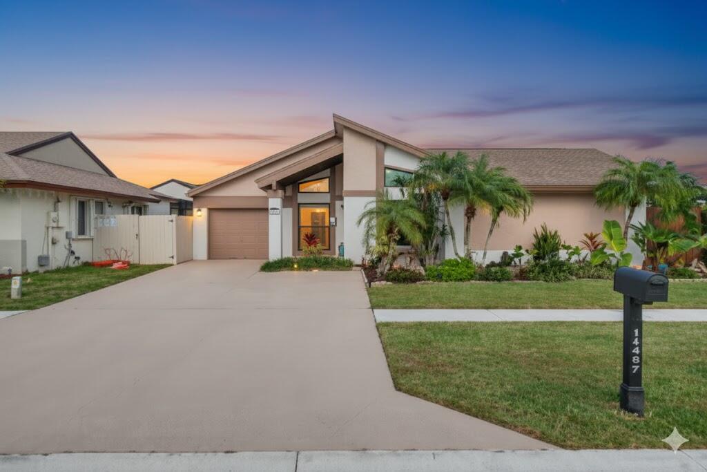 11457 Country Sound Court Boca Raton, FL 33428 - Photo 1 of 111 Front House Twilight