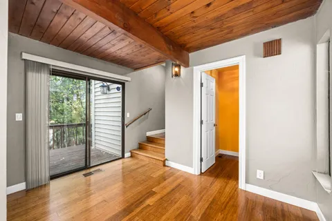 a view of an empty room with a fireplace