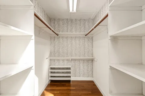 a view of a house with a door and wooden floor