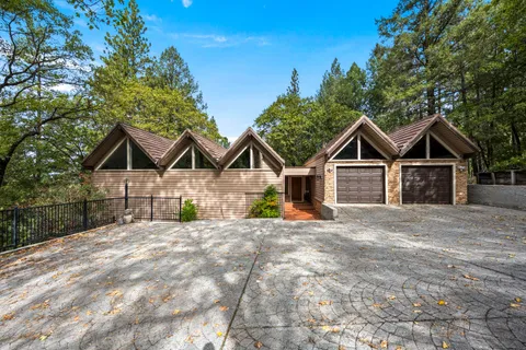 a view of a wooden deck and a yard