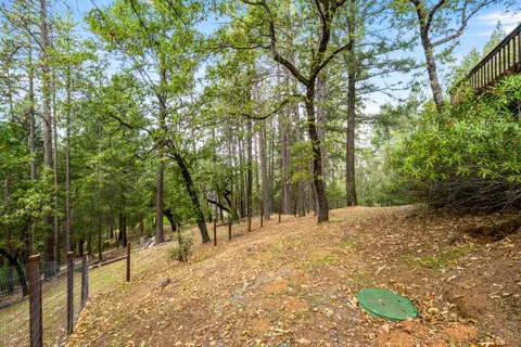 an aerial view of a house with yard swimming pool and outdoor seating