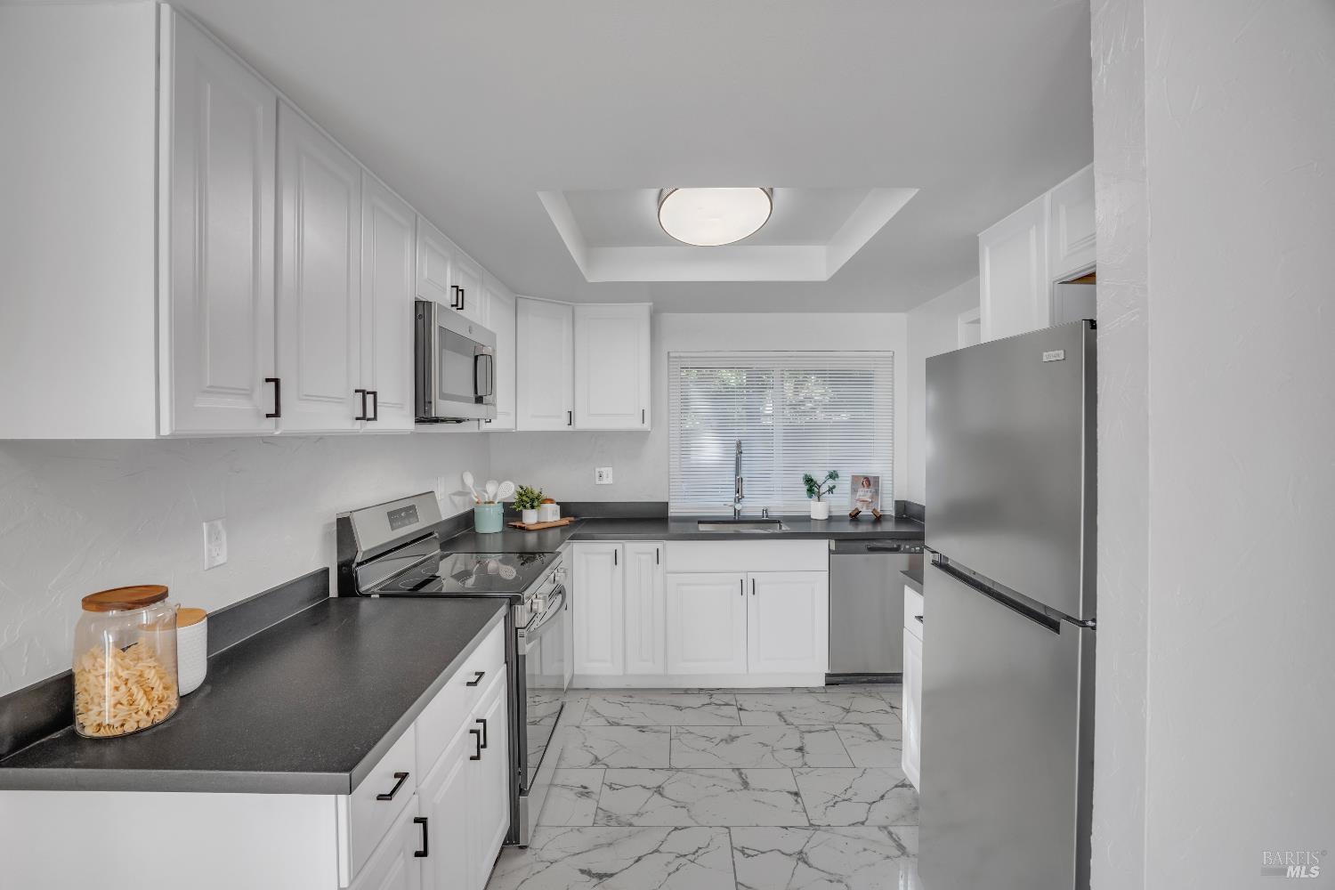 2785 Canyon Creek Drive San Ramon, CA 94583 - Photo 11 of 36 a kitchen with stainless steel appliances granite countertop a sink stove and refrigerator