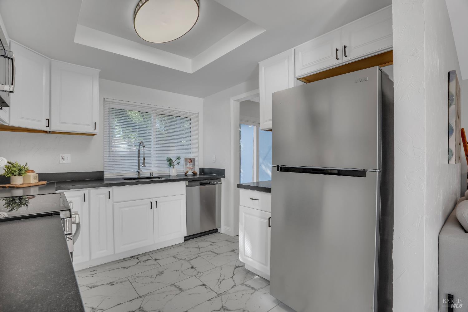 2785 Canyon Creek Drive San Ramon, CA 94583 - Photo 14 of 36 a kitchen with a refrigerator sink and cabinets
