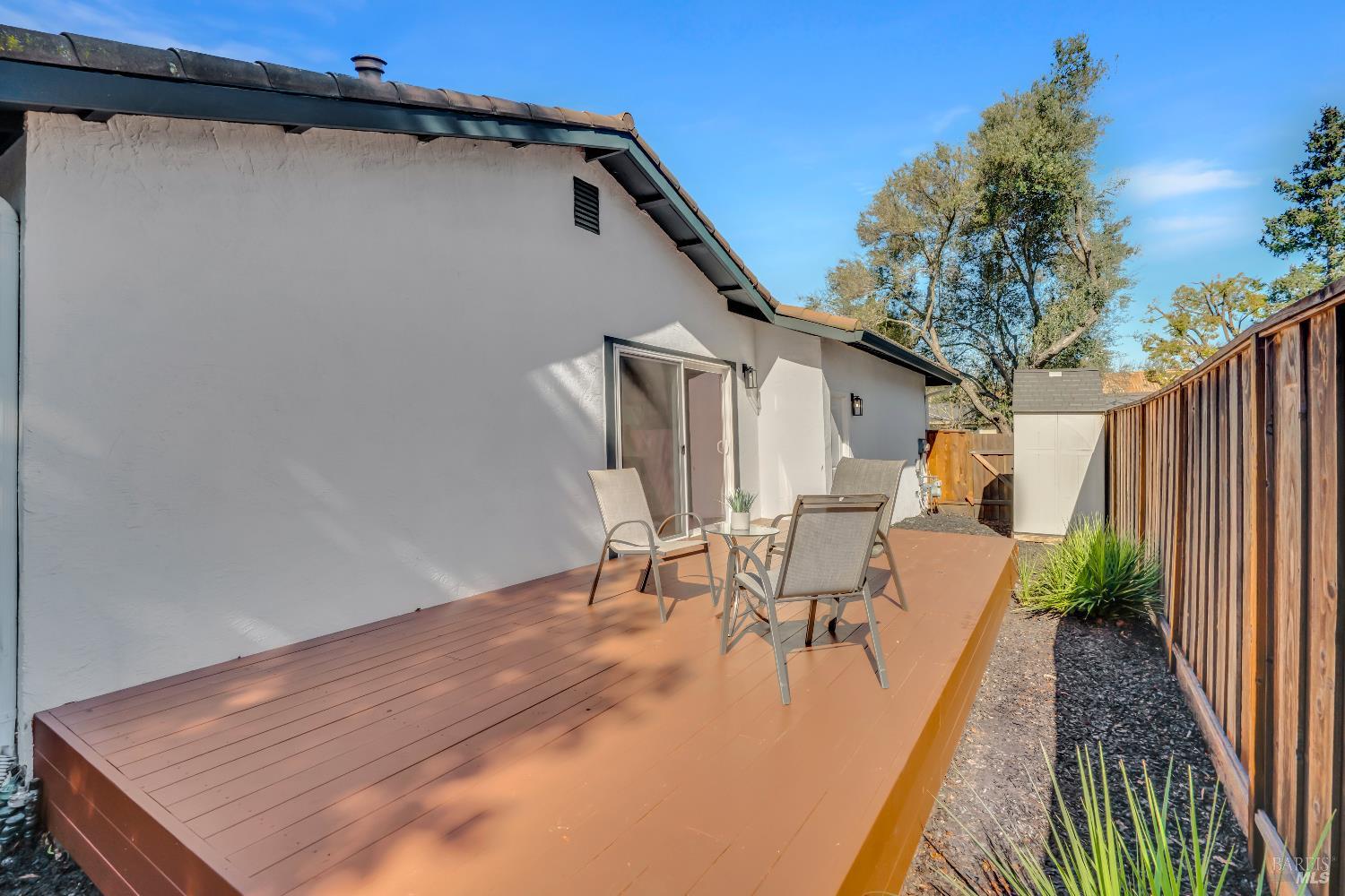 2785 Canyon Creek Drive San Ramon, CA 94583 - Photo 35 of 36 a view of a patio with table and chairs with wooden floor and fence