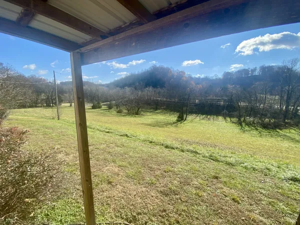 a view of a swimming pool with an outdoor space and seating area
