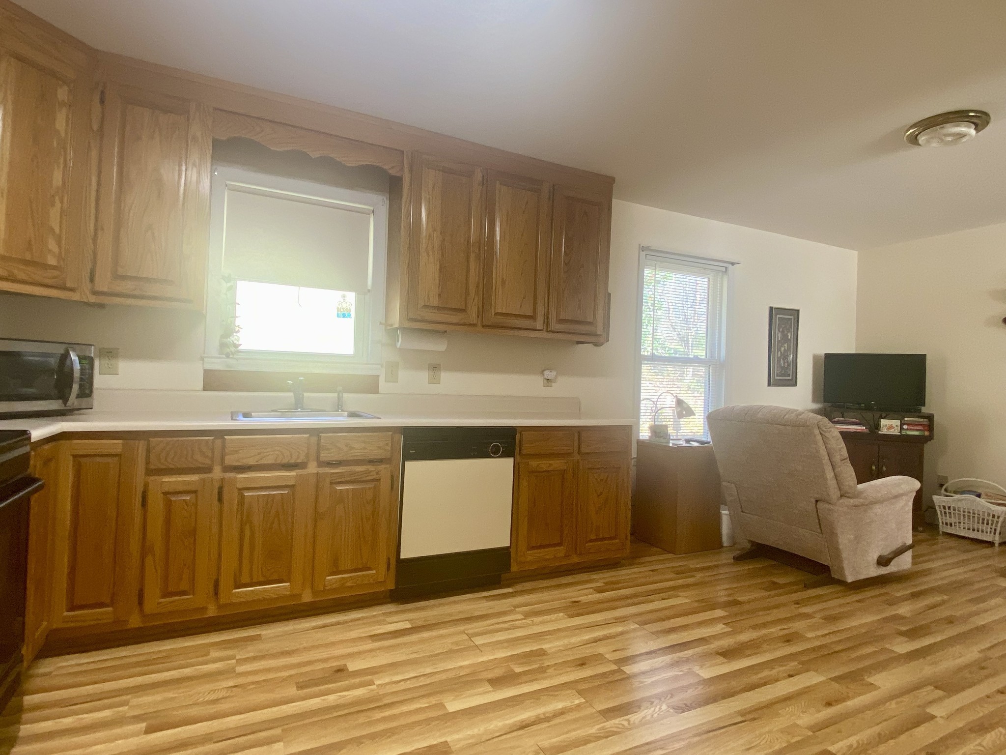 4570 Highway 64 Pulaski, TN 38478 - Photo 31 of 31 a kitchen with granite countertop a sink cabinets and wooden floor