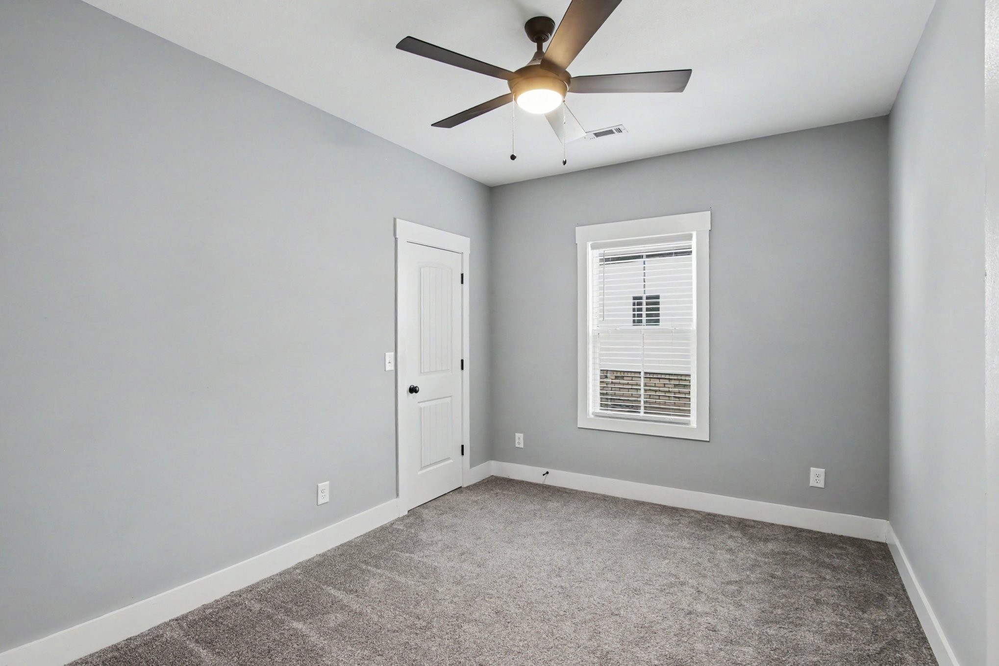 7208 Winding Way Pleasant View, TN 37146 - Photo 26 of 30 an empty room with a window and a fan